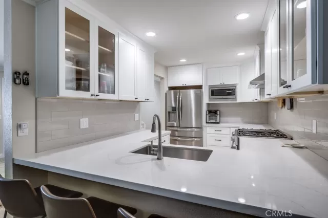 MLS: OC24070157 Condo For Sale