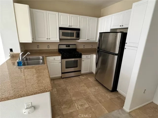 MLS: OC24098161 Condo For Sale