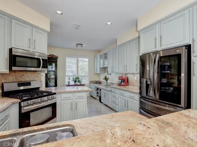 MLS: OC25117116 Condo For Sale